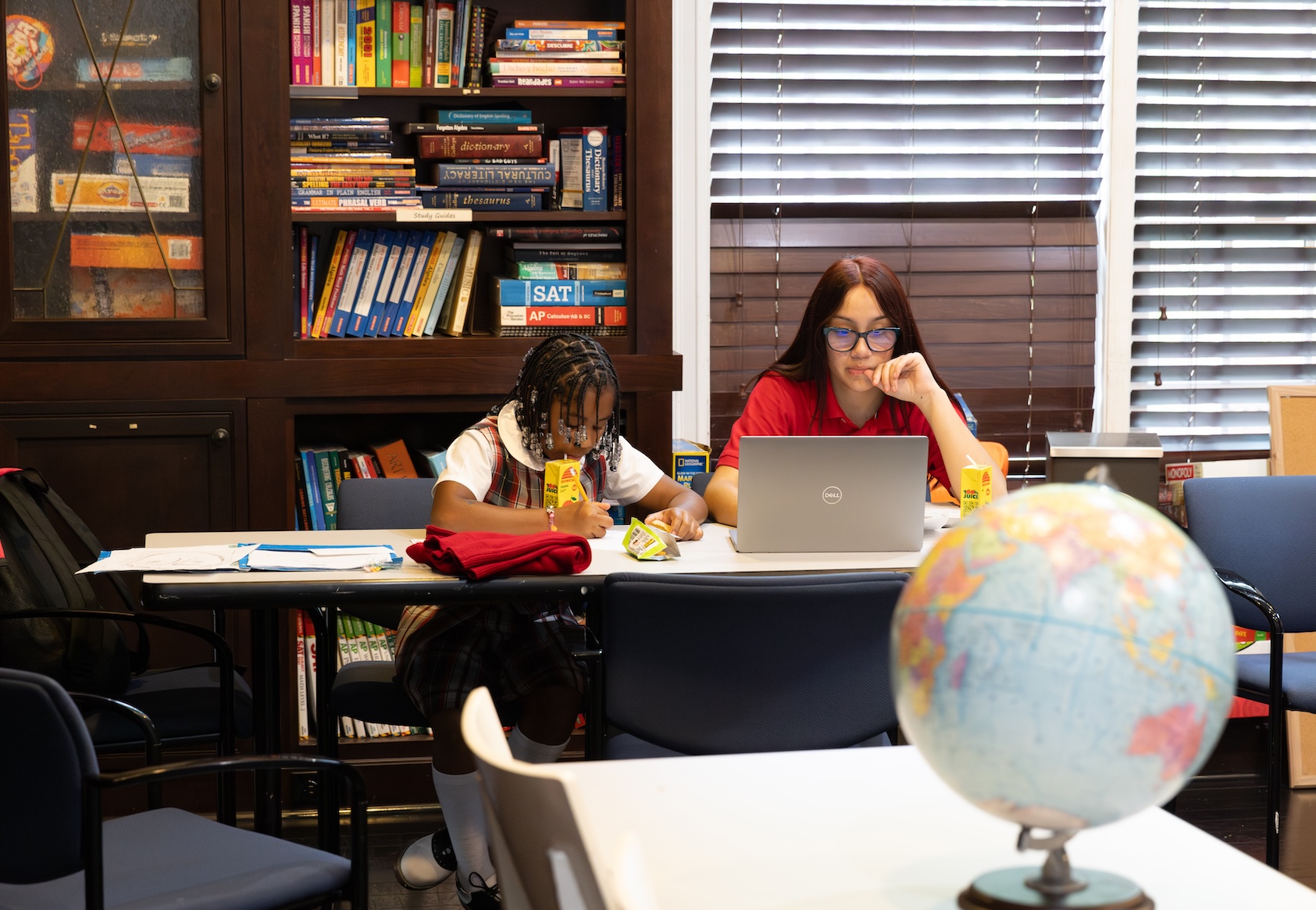 girls studying in library