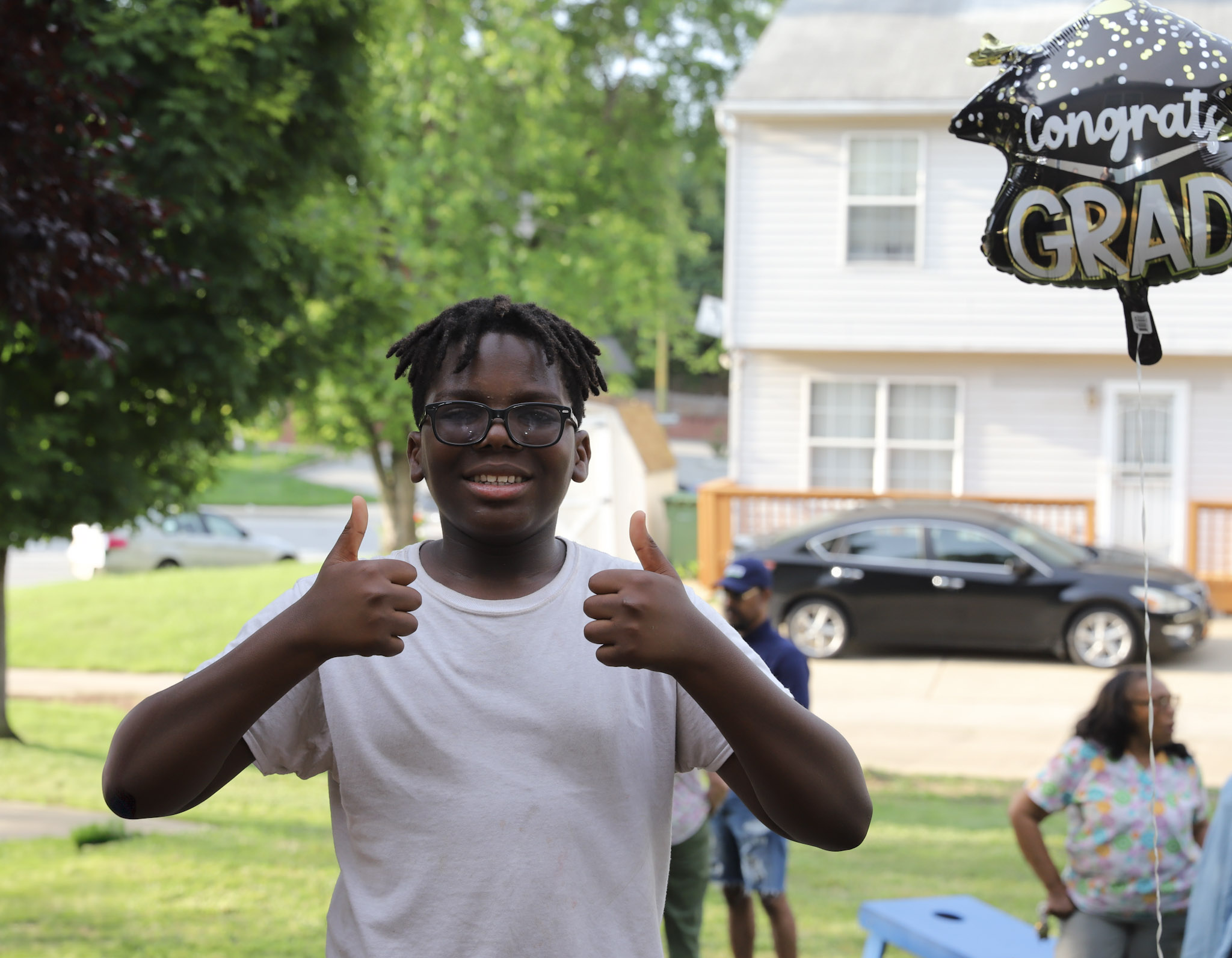 graduation celebration thumbs up